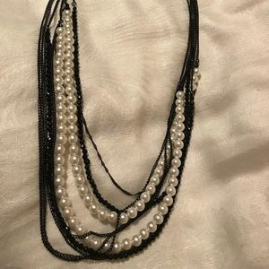 Long black and pearl necklace